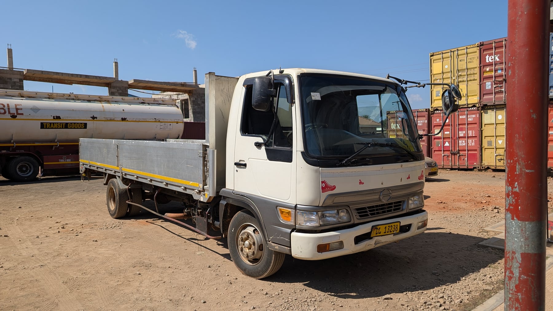 White 5-tonne Hino flatbed truck