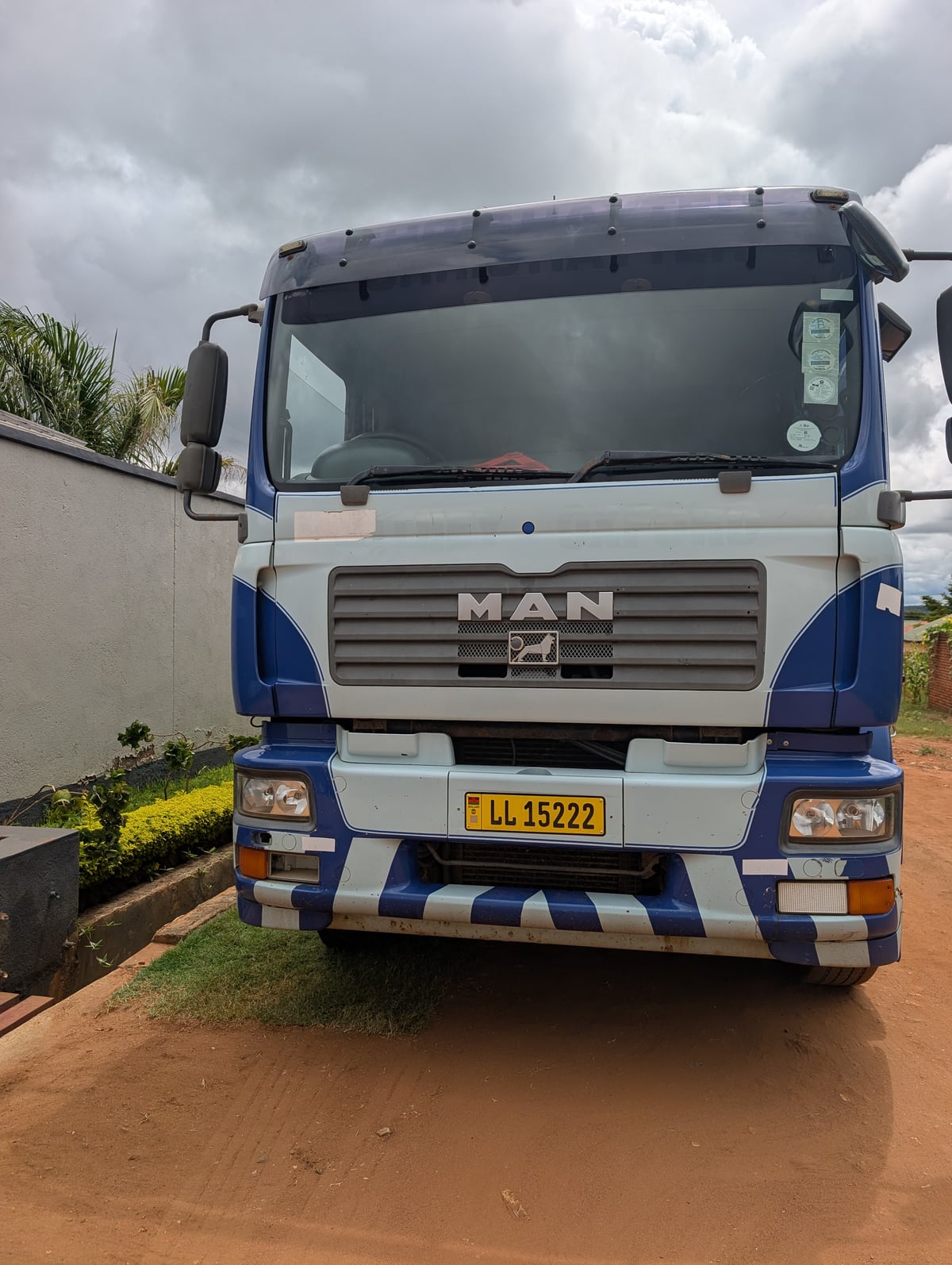 Front view of the blue and white MAN 10-tonne truck