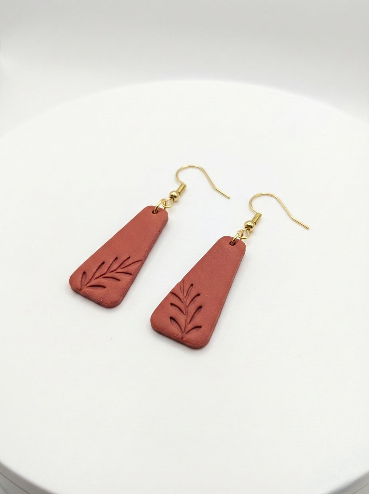 Handcrafted terracotta polymer clay earrings with leaf details